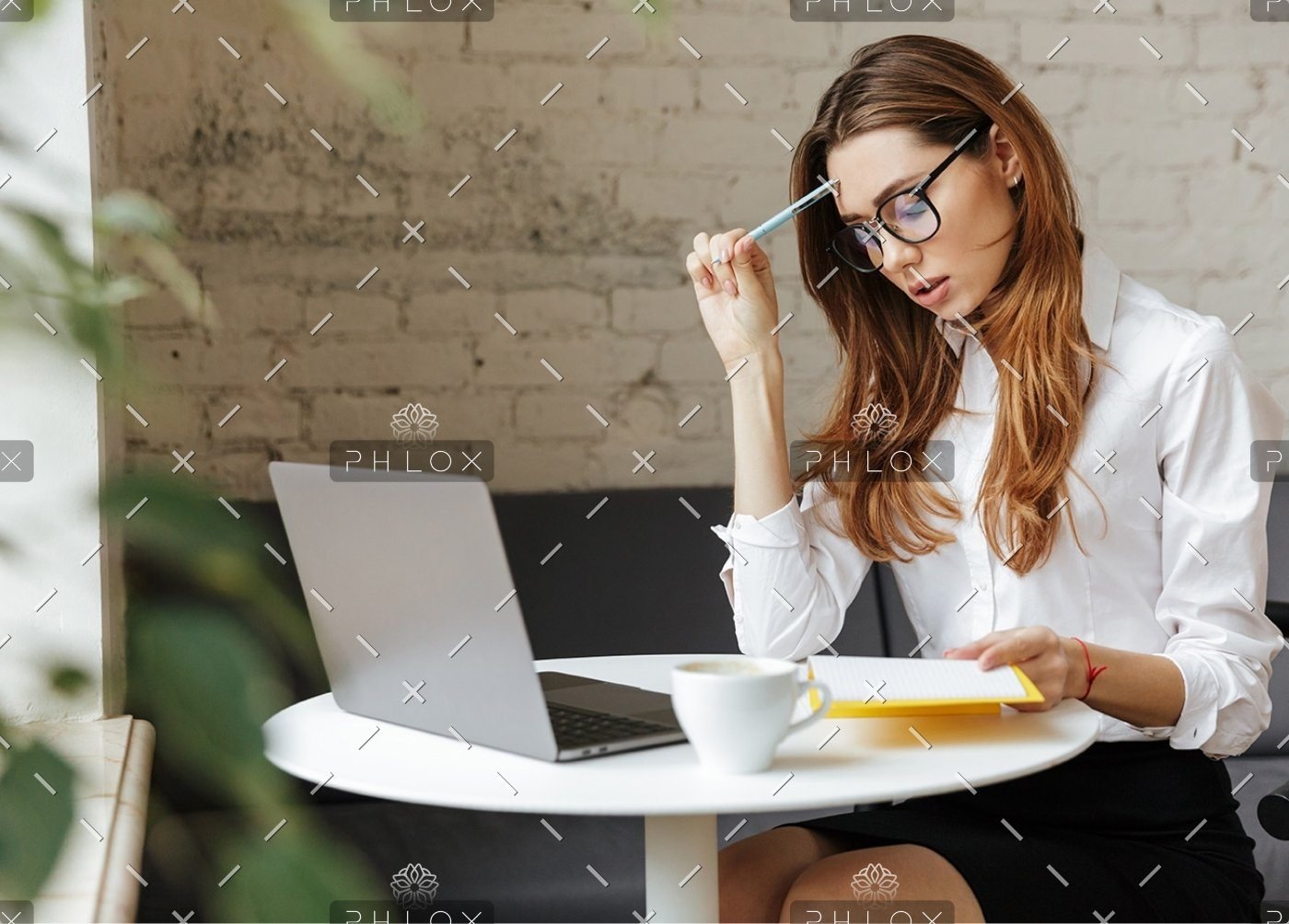 demo-attachment-407-thoughtful-business-woman-indoors-using-laptop-P5HYUQX